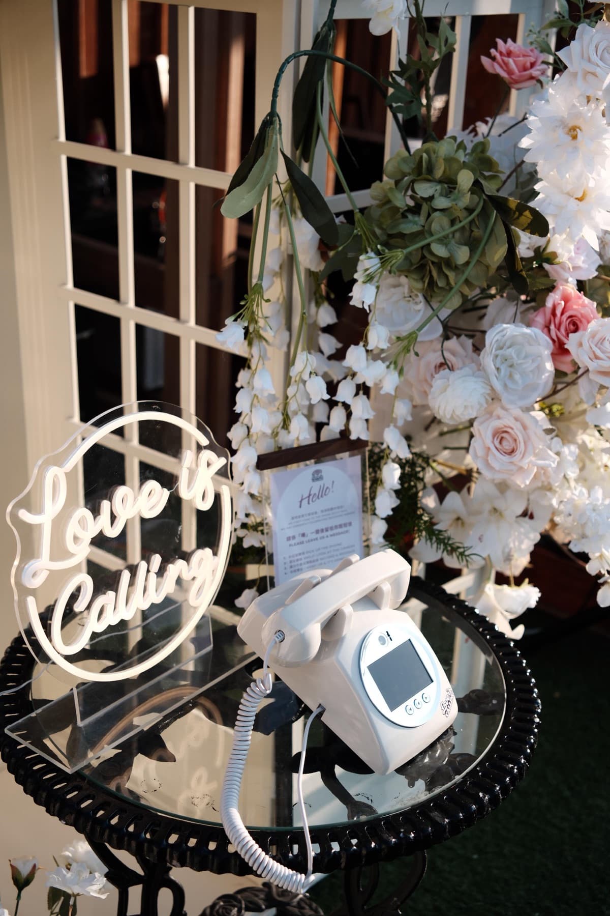 Guests enjoying Love is Calling video guestbook at a Hong Kong wedding